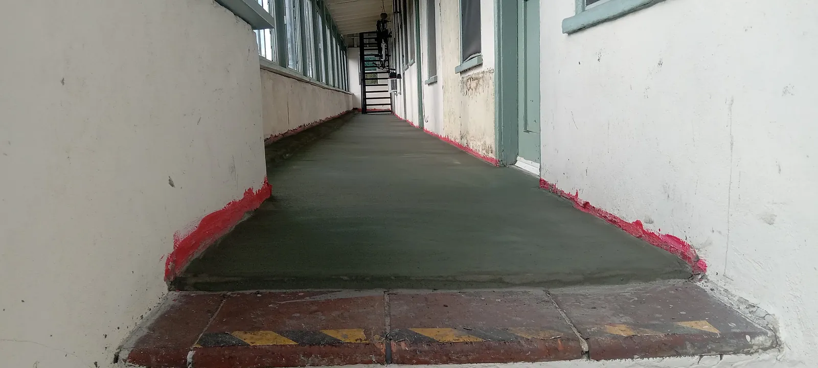Exterior walkway detail from a completed waterproofing repair in Long Beach