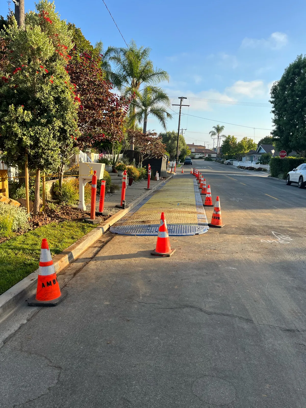 Protected street work area during completed underground utility connection work in Newport Beach