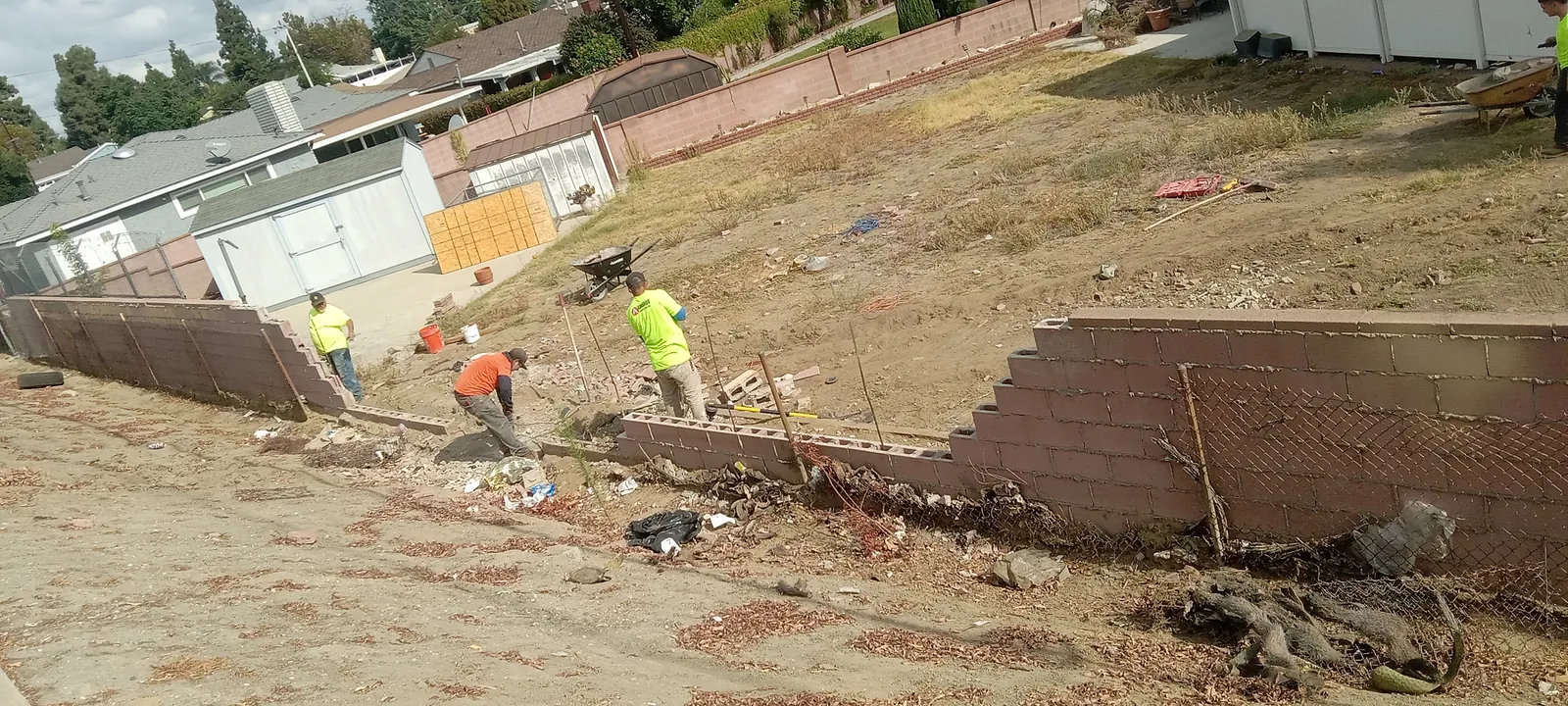 Exterior masonry work during a completed block wall repair in Pico Rivera
